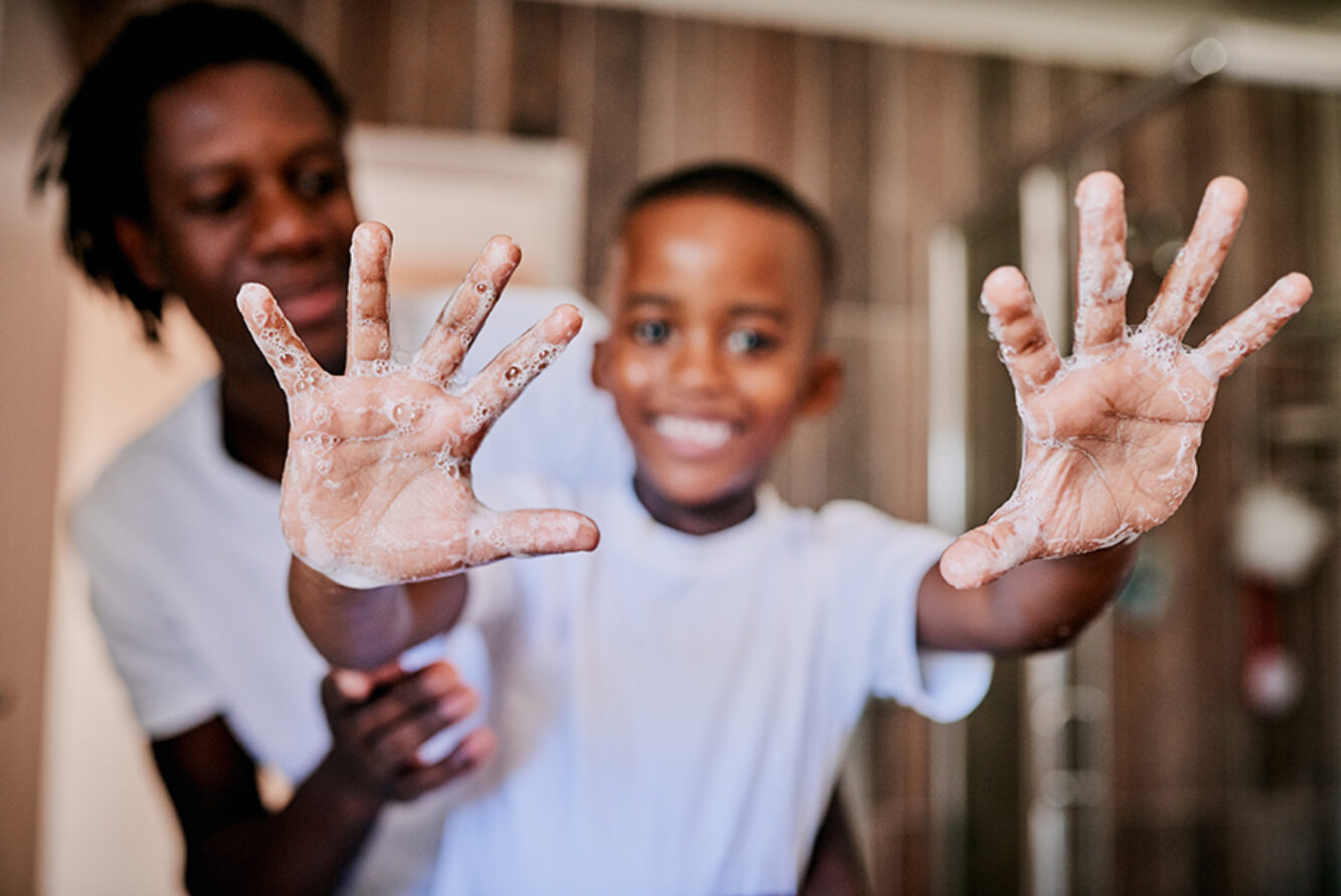 Father holding kid with Jammin Jelly handwash on hands